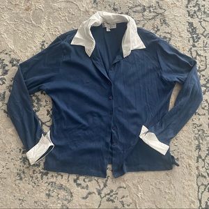 Blue button up sweater with white collar